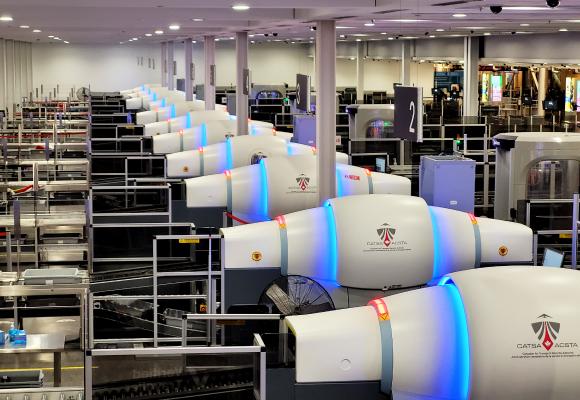 CT X-ray machines at a Montreal-Trudeau International Airport (YUL) security checkpoint.